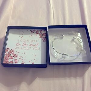 Silver bangle with infinity knot